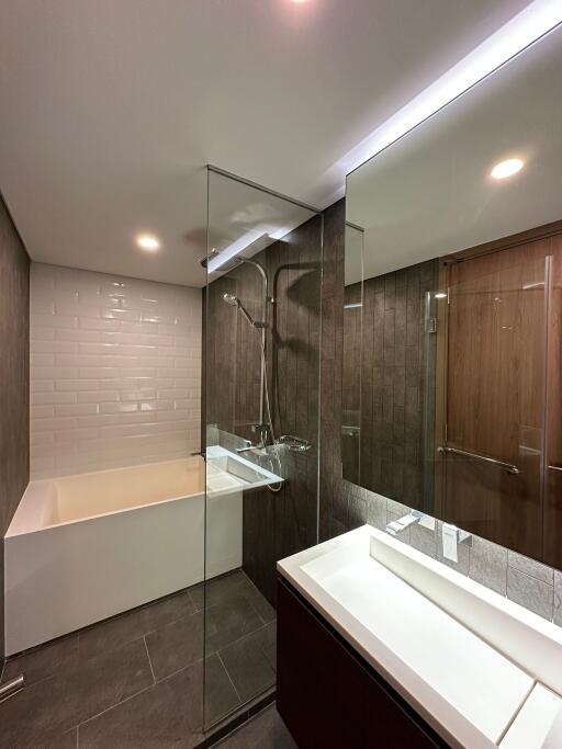 Modern bathroom with glass shower and bathtub