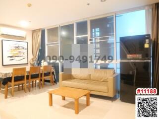 Modern living room with open layout leading to the kitchen area