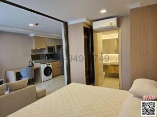 Compact bedroom with integrated living and kitchenette area