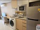 Modern kitchen with stainless steel appliances and wooden cabinets