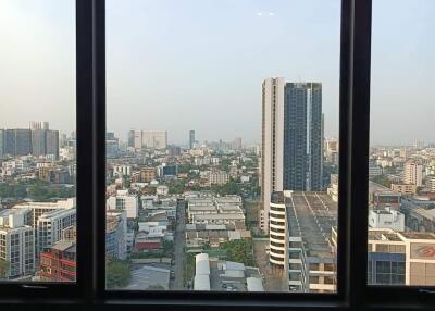 City view from high-rise building window