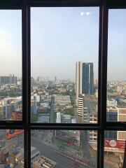 City view from high-rise building window