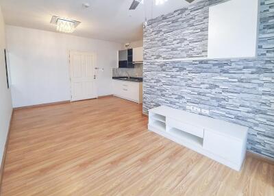 Spacious combined living room and kitchen area with modern finishes