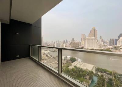 Spacious balcony with a view of the city skyline and river