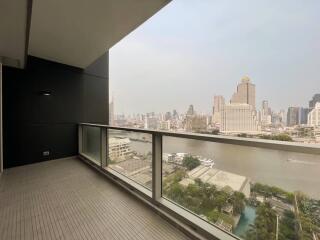 Spacious balcony with a view of the city skyline and river