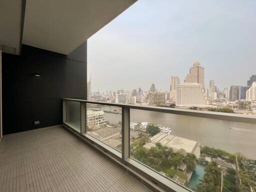 Spacious balcony with a view of the city skyline and river