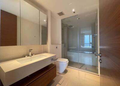 Modern bathroom interior with wooden finish and glass shower