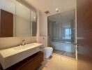 Modern bathroom interior with wooden finish and glass shower