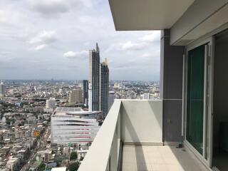 Balcony view of a high-rise apartment overlooking the city