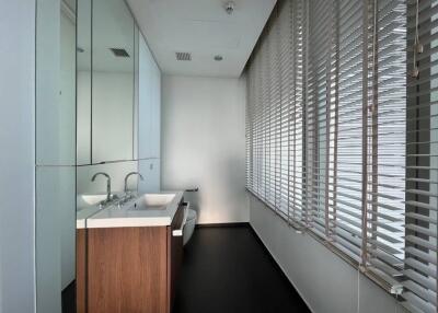 Modern bathroom with large window and blinds