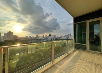 Spacious balcony with city view at sunset