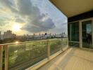 Spacious balcony with city view at sunset