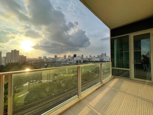 Spacious balcony with city view at sunset