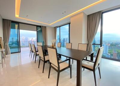 Spacious dining room with large windows and city view