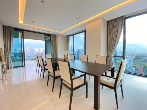 Spacious dining room with large windows and city view