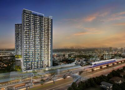 Exterior view of a modern skyscraper building at dusk with city and transportation infrastructure in the foreground