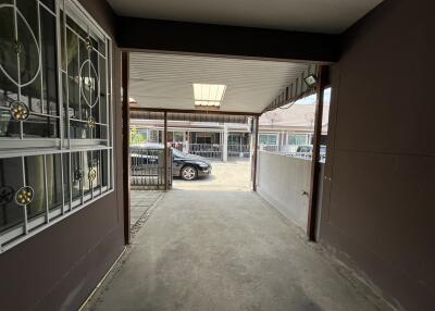 Spacious garage with concrete floor and secured windows