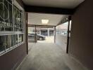 Spacious garage with concrete floor and secured windows
