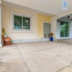 Bright and clean front porch of a residential building with window and door