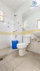 Clean bathroom with white ceramics and decorative tiles