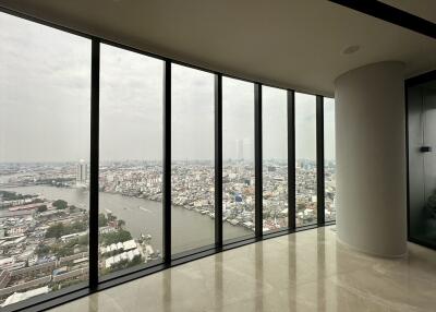 Spacious living room with large windows and panoramic city view