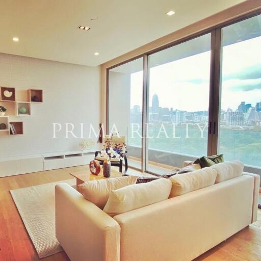 Modern living room with a large window offering a city view