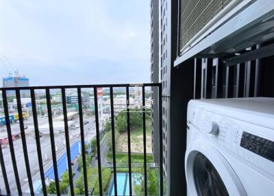 View from balcony with washing machine overlooking the city
