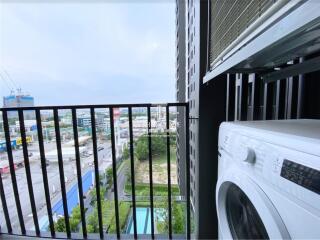 View from balcony with washing machine overlooking the city