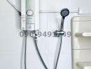 Modern water heater system with shower head and bathroom fixtures