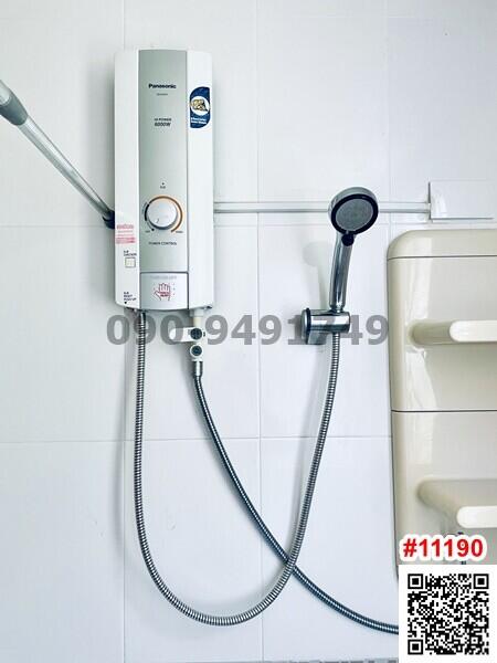 Modern water heater system with shower head and bathroom fixtures