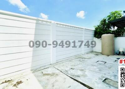 Spacious private outdoor area with high fence for privacy