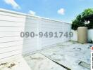 Spacious private outdoor area with high fence for privacy