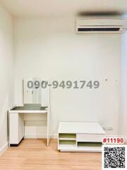Compact bedroom with air conditioning and built-in shelves