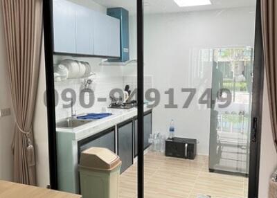 Modern kitchen with sliding glass doors and air conditioning unit