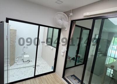 Modern building interior with glass partition and bathroom visible
