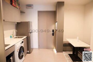 Compact kitchen with modern appliances and marble countertop