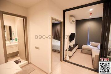 Modern bedroom with en suite bathroom and mirrored wardrobe