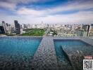 Infinity pool with city skyline view