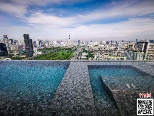 Infinity pool with city skyline view