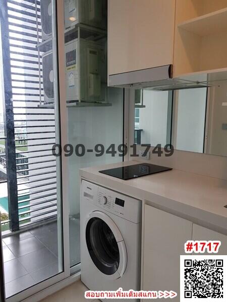 Compact kitchen with washing machine and modern appliances