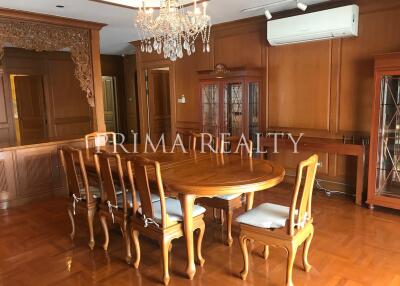 Elegant dining room with wooden table and chandelier