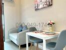 Cozy dining area with modern furniture and artwork