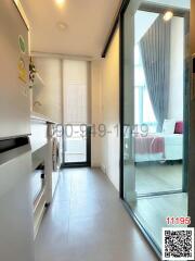 Compact kitchen interior with modern appliances and access to bedroom area
