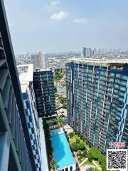 Arial view of a residential complex with swimming pool and garden