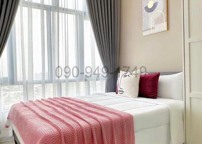 Cozy bedroom with natural light and modern decor