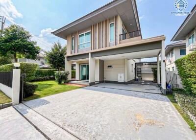 Modern two-story house with a spacious driveway and garage