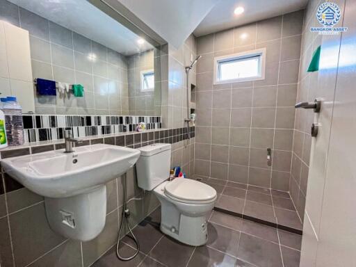 Modern bathroom interior with tiled walls and flooring