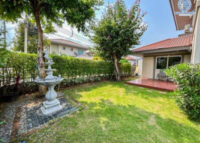 Cozy backyard with a fountain and patio area