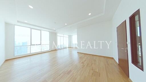 Spacious and Bright Empty Living Room with Hardwood Floors