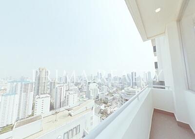 City view from high-rise apartment balcony